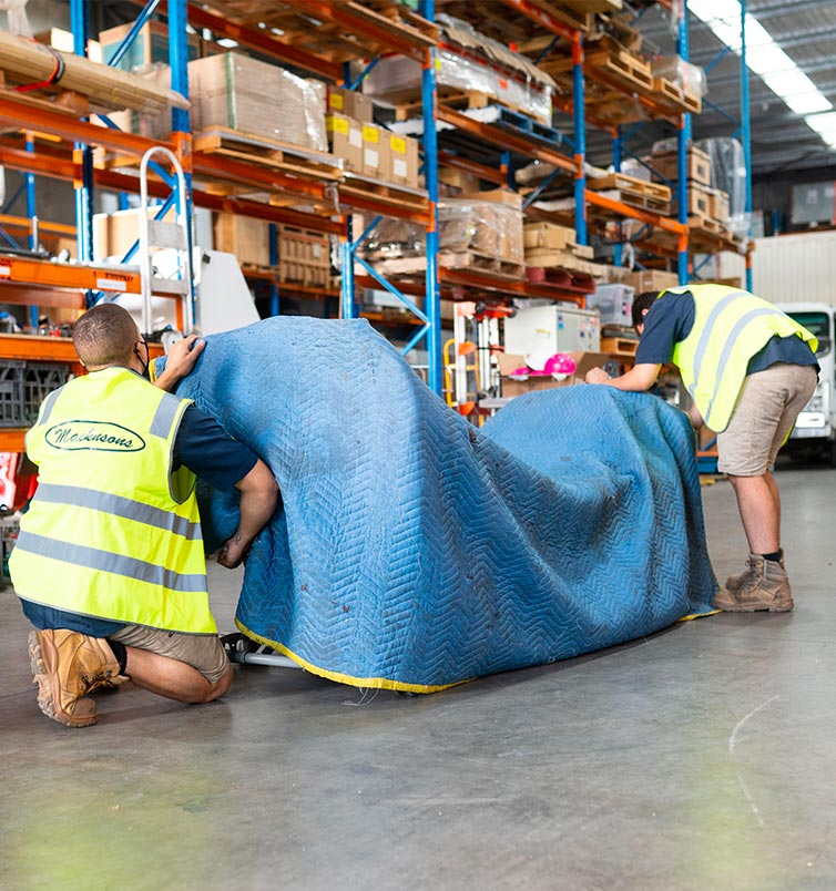 Two people handling some freight